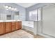 Relaxing bathroom featuring a separate shower, soaking tub, and dual vanity at 4396 E Austin Ln, San Tan Valley, AZ 85140