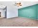 Large bedroom with ceiling fan, carpet flooring and ensuite bathroom at 4396 E Austin Ln, San Tan Valley, AZ 85140