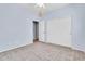 Bedroom with neutral carpet, double door closet, ceiling fan and en-suite door at 4396 E Austin Ln, San Tan Valley, AZ 85140