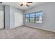 Bedroom featuring neutral colors, a window, a ceiling fan and a closet at 4396 E Austin Ln, San Tan Valley, AZ 85140