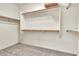Walk-in closet boasting multiple wooden rods, shelving, and carpet flooring at 4396 E Austin Ln, San Tan Valley, AZ 85140
