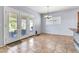 Dining area with tiled floors, modern lighting fixture, and access to the backyard at 4396 E Austin Ln, San Tan Valley, AZ 85140