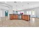 Well-lit kitchen featuring wood cabinets, stainless steel appliances, and pendant lighting above the island at 4396 E Austin Ln, San Tan Valley, AZ 85140
