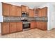 Well-equipped kitchen featuring stainless steel appliances, granite countertops, and mosaic backsplash at 4396 E Austin Ln, San Tan Valley, AZ 85140