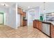 Open kitchen showcasing ample counter space, tile flooring, and modern cabinetry at 4396 E Austin Ln, San Tan Valley, AZ 85140