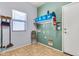 Laundry room featuring tile flooring, shelving, and washer/dryer hookups at 4396 E Austin Ln, San Tan Valley, AZ 85140