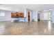 Open-concept living space with tiled floors and kitchen with light blue walls at 4396 E Austin Ln, San Tan Valley, AZ 85140