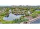 Beautiful aerial view of community pond with waterfall features, playground, and walking paths at 4408 W Heyerdahl Dr, New River, AZ 85087