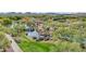Attractive aerial view of community lake with playground and lush landscaping at 4408 W Heyerdahl Dr, New River, AZ 85087