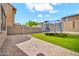 Inviting backyard with a trampoline, artificial grass, and a paver patio at 4408 W Heyerdahl Dr, New River, AZ 85087