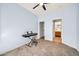Cozy bedroom with carpet flooring and view into bathroom at 4408 W Heyerdahl Dr, New River, AZ 85087