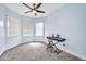 Bright bedroom with two windows, ceiling fan and a keyboard at 4408 W Heyerdahl Dr, New River, AZ 85087