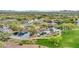Beautiful aerial view of the community park, showcasing the lake, playground, and walking trails for residents at 4408 W Heyerdahl Dr, New River, AZ 85087