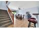 Bright dining room with a ceiling fan and stairway at 4408 W Heyerdahl Dr, New River, AZ 85087