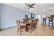 Charming dining room with a wooden table, chairs, and tile flooring at 4408 W Heyerdahl Dr, New River, AZ 85087