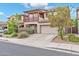 Two-story home with a two-car garage and a balcony at 4408 W Heyerdahl Dr, New River, AZ 85087