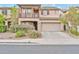 Charming two-story home with balcony, manicured landscaping, and a two-car garage at 4408 W Heyerdahl Dr, New River, AZ 85087