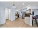 Bright kitchen featuring white cabinets, stainless steel appliances, and tile flooring at 4408 W Heyerdahl Dr, New River, AZ 85087