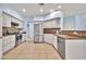 Spacious kitchen with stainless steel appliances, tile floors and white cabinets at 4408 W Heyerdahl Dr, New River, AZ 85087