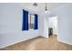Cozy laundry room area with tile flooring, dark blue curtains, and modern fixtures at 4408 W Heyerdahl Dr, New River, AZ 85087