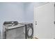 Functional laundry room with modern Samsung washer and dryer at 4408 W Heyerdahl Dr, New River, AZ 85087