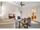 Spacious living room with plush carpet, ceiling fan, and media center at 4408 W Heyerdahl Dr, New River, AZ 85087