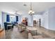 Spacious living room with plush seating, carpet and open layout to dining area at 4408 W Heyerdahl Dr, New River, AZ 85087