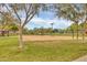 Community sand volleyball court with mature trees and landscaping at 4408 W Heyerdahl Dr, New River, AZ 85087