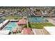 Aerial view of the community pool with lounge chairs and tennis courts at 515 S Parkcrest -- # 531, Mesa, AZ 85206