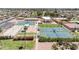 An aerial view of the community's tennis and bocce ball courts with landscaping and the community center at 515 S Parkcrest -- # 531, Mesa, AZ 85206