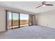 Large sliding glass doors opening to carpeted balcony with scenic views at 515 S Parkcrest -- # 531, Mesa, AZ 85206