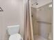 This bathroom features a walk-in shower with a shower curtain, and a convenient toilet at 515 S Parkcrest -- # 531, Mesa, AZ 85206