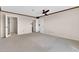 Open bedroom with a ceiling fan and three doorways at 515 S Parkcrest -- # 531, Mesa, AZ 85206