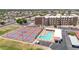 Aerial view of condo complex with community pool and tennis, and pickleball courts at 515 S Parkcrest -- # 531, Mesa, AZ 85206
