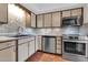 Well-lit kitchen with stainless steel appliances and beautiful, decorative tile backsplash at 515 S Parkcrest -- # 531, Mesa, AZ 85206