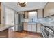 Bright kitchen showcasing stainless steel appliances, tiled floor, and ample counter space at 515 S Parkcrest -- # 531, Mesa, AZ 85206