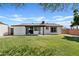 Spacious backyard with lush green grass and mature landscaping at 540 W La Donna Dr, Tempe, AZ 85283