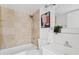 Bathroom with tiled shower-tub, modern vanity, and decorative art at 540 W La Donna Dr, Tempe, AZ 85283