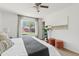 Bedroom featuring a large window overlooking the yard and a ceiling fan at 540 W La Donna Dr, Tempe, AZ 85283