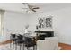 This staged dining room features a glass table, stylish chairs, and access to an outdoor patio at 540 W La Donna Dr, Tempe, AZ 85283