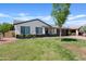 Charming home with green lawn, mature tree, and two-car garage at 540 W La Donna Dr, Tempe, AZ 85283