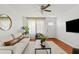 Bright living room filled with natural light, hardwood floors, and stylish neutral decor at 540 W La Donna Dr, Tempe, AZ 85283