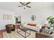 Inviting living room with stylish furnishings, wood floors, neutral decor, and abundant natural light at 540 W La Donna Dr, Tempe, AZ 85283