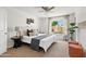 Bright bedroom with neutral tones, ceiling fan, large window, and stylish furnishings at 540 W La Donna Dr, Tempe, AZ 85283