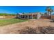 A expansive backyard with grass, patio, and parking space for a boat or utility trailer at 5624 W Villa Theresa Dr, Glendale, AZ 85308