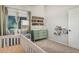 This Bedroom includes decor, a crib, dresser and changing table, and a glider at 5624 W Villa Theresa Dr, Glendale, AZ 85308