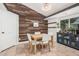 Dining room with wood accent wall and modern decor at 5624 W Villa Theresa Dr, Glendale, AZ 85308