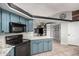Modern kitchen with ample countertop space and stylish black appliances at 5624 W Villa Theresa Dr, Glendale, AZ 85308
