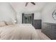 Comfortable bedroom with a ceiling fan, a large window with plant decor, and lots of storage at 5624 W Villa Theresa Dr, Glendale, AZ 85308