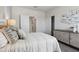 Bright bedroom featuring soft, neutral décor, natural light, carpeted floors, and closet at 5806 E Axle Ln, San Tan Valley, AZ 85140